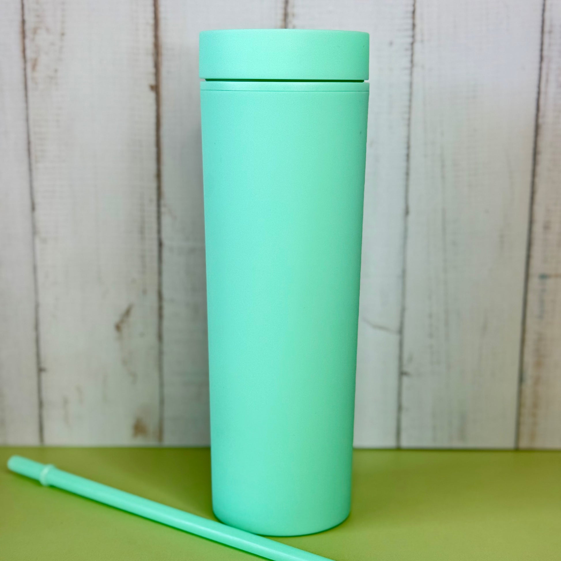 Mint green tumbler with customization options with vinyl letters