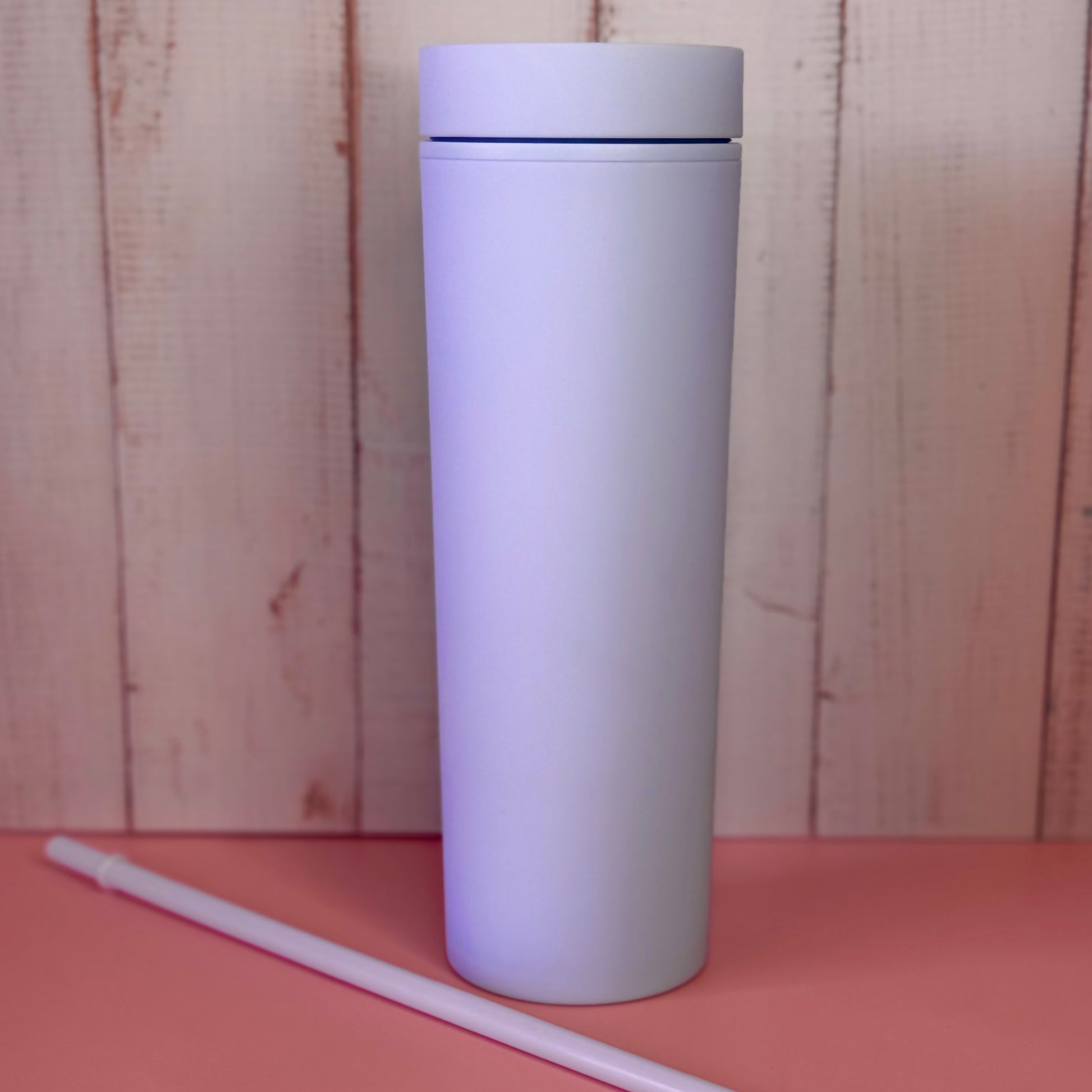 Purple insulated tumbler with straw for cold drinks