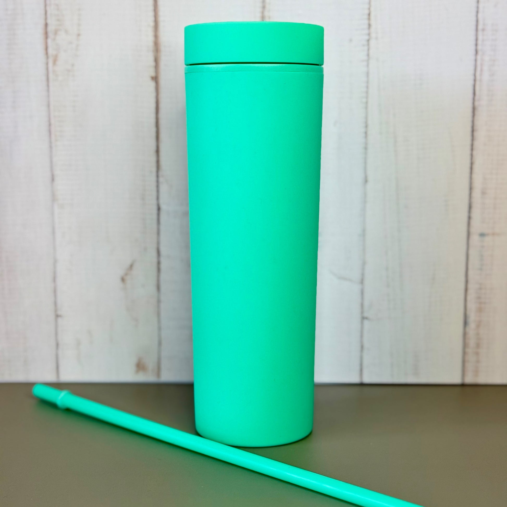 Turquoise 16oz tumbler with a matching straw 