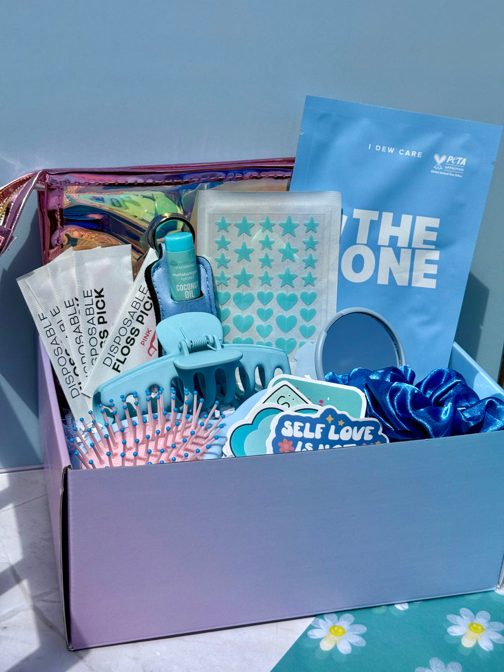 Blue curated self care kit with beauty items cute themed box for teens and women including hair care accessories